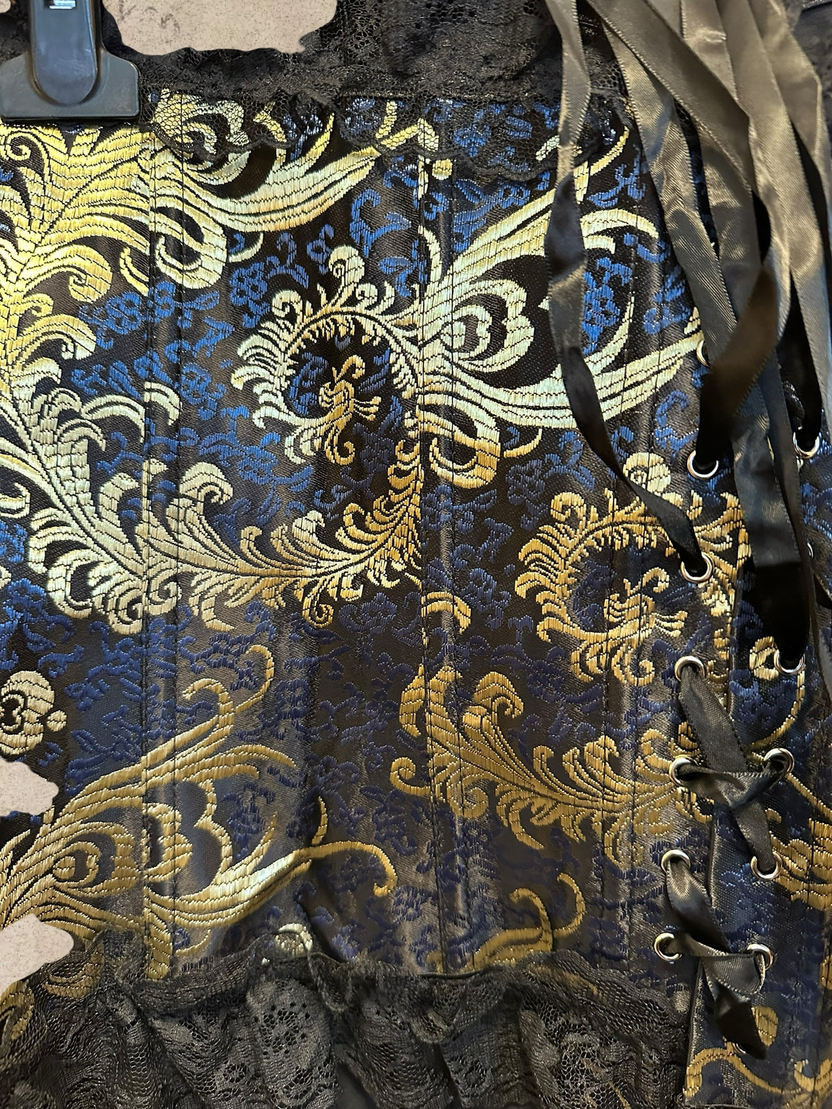 Victorian navy corset with gold brocade and black lace. Adjustable satin lace-up design. A timeless gothic statement piece