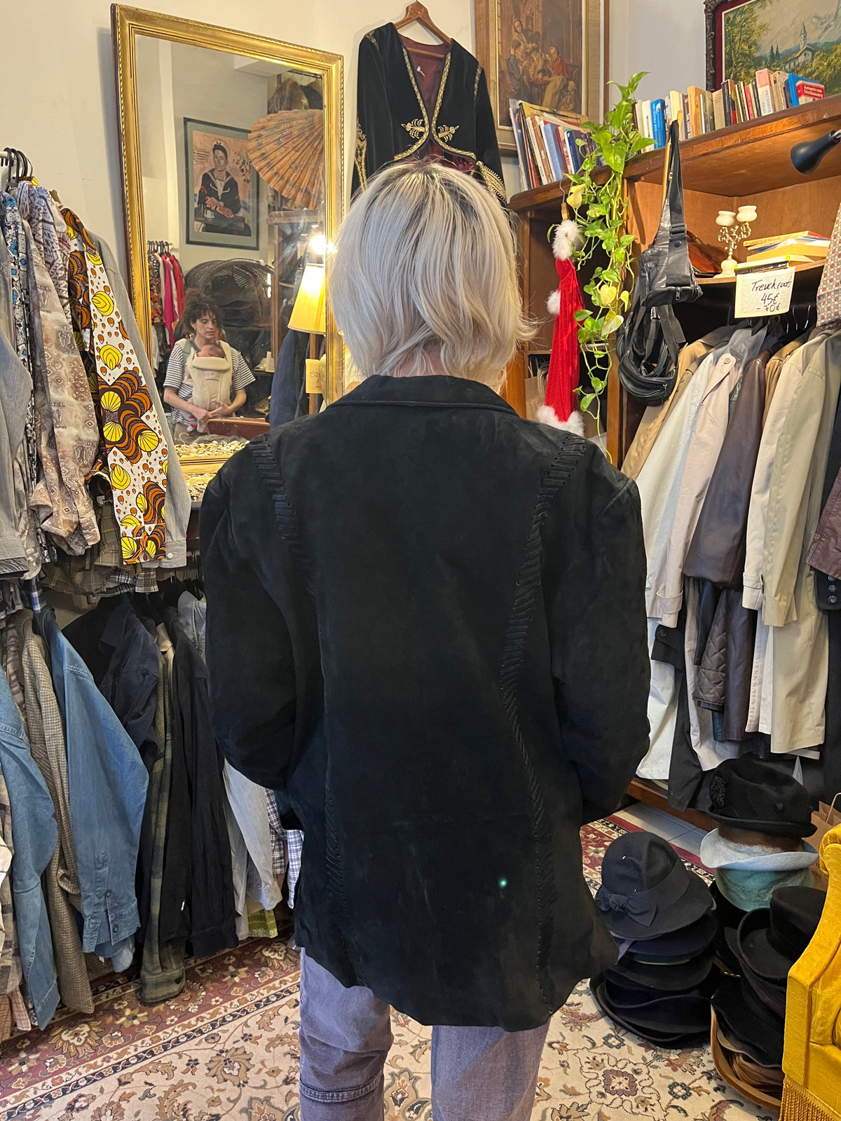 Vintage black suede blazer featuring intricate woven leather detailing along the front, shoulders, and back. Designed with a relaxed oversized fit, classic lapels, and understated button closure.