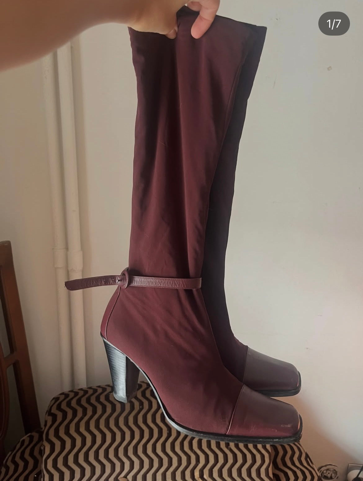 Deep burgundy sock boots with a sleek square toe and mid-height heel.
