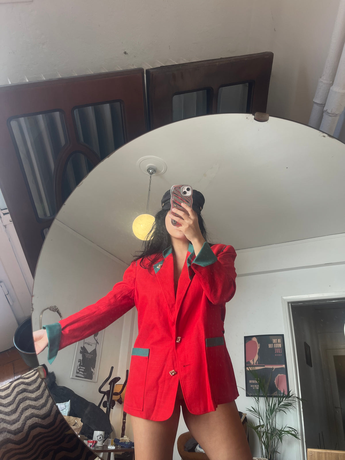 Vintage red blazer with contrasting green details and statement gold-tone buttons. Features structured shoulders and an oversized ’80s-inspired silhouette