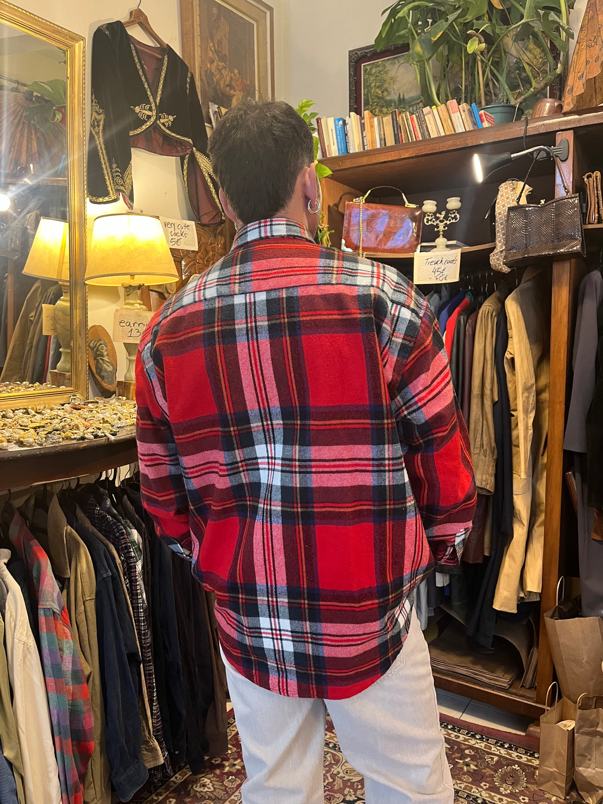 Vintage red tartan flannel shirt featuring a bold plaid pattern and double chest pockets. Relaxed oversized fit with a classic grunge-inspired 90s feel