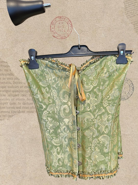 Victorian sage green corset with gold brocade and satin ruffles. Adjustable lace-up back for a flattering fit. A romantic statement piece with vintage charm.