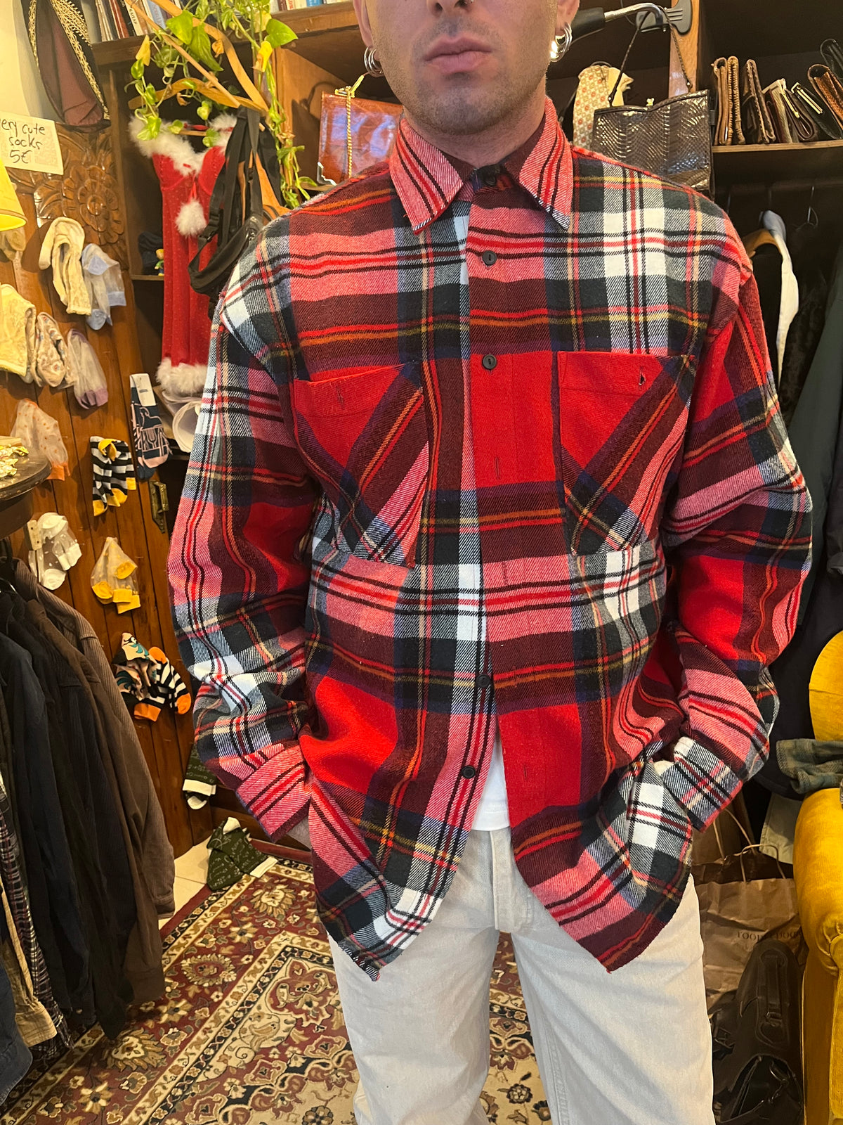 Vintage red tartan flannel shirt featuring a bold plaid pattern and double chest pockets. Relaxed oversized fit with a classic grunge-inspired 90s feel