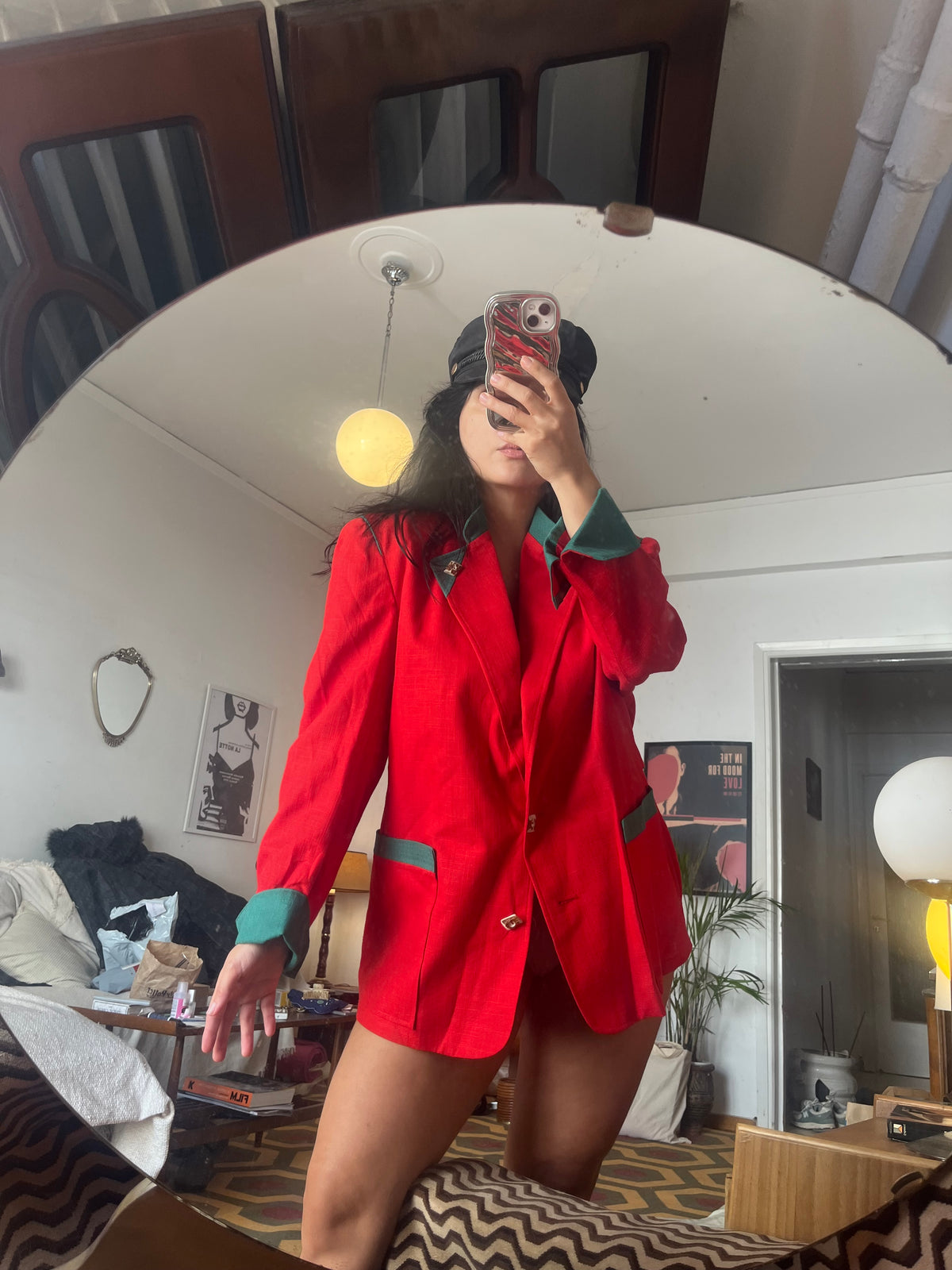 Vintage red blazer with contrasting green details and statement gold-tone buttons. Features structured shoulders and an oversized ’80s-inspired silhouette
