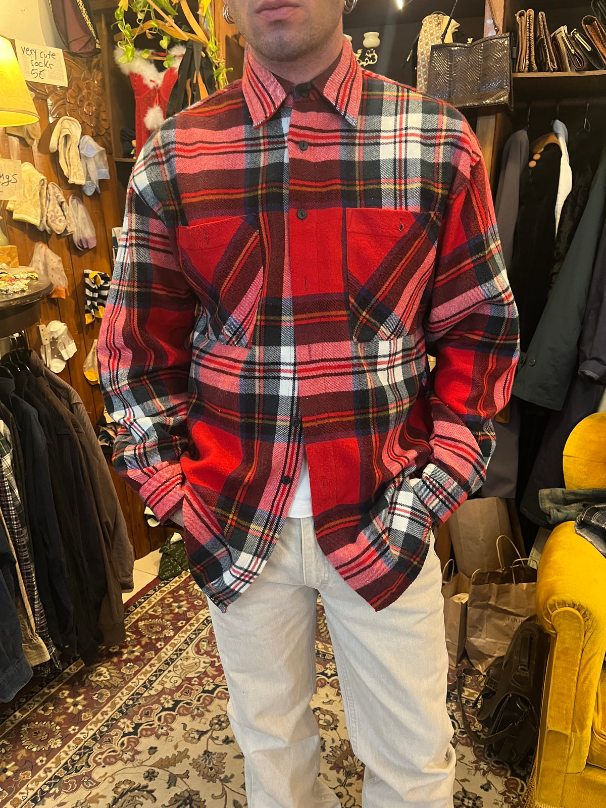 Vintage red tartan flannel shirt featuring a bold plaid pattern and double chest pockets. Relaxed oversized fit with a classic grunge-inspired 90s feel