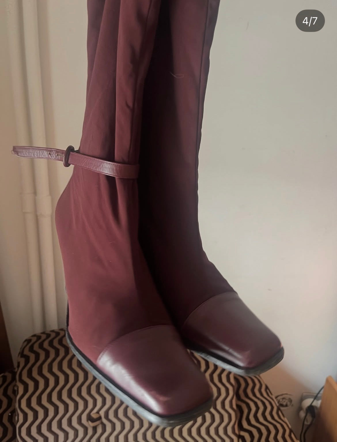 Deep burgundy sock boots with a sleek square toe and mid-height heel.