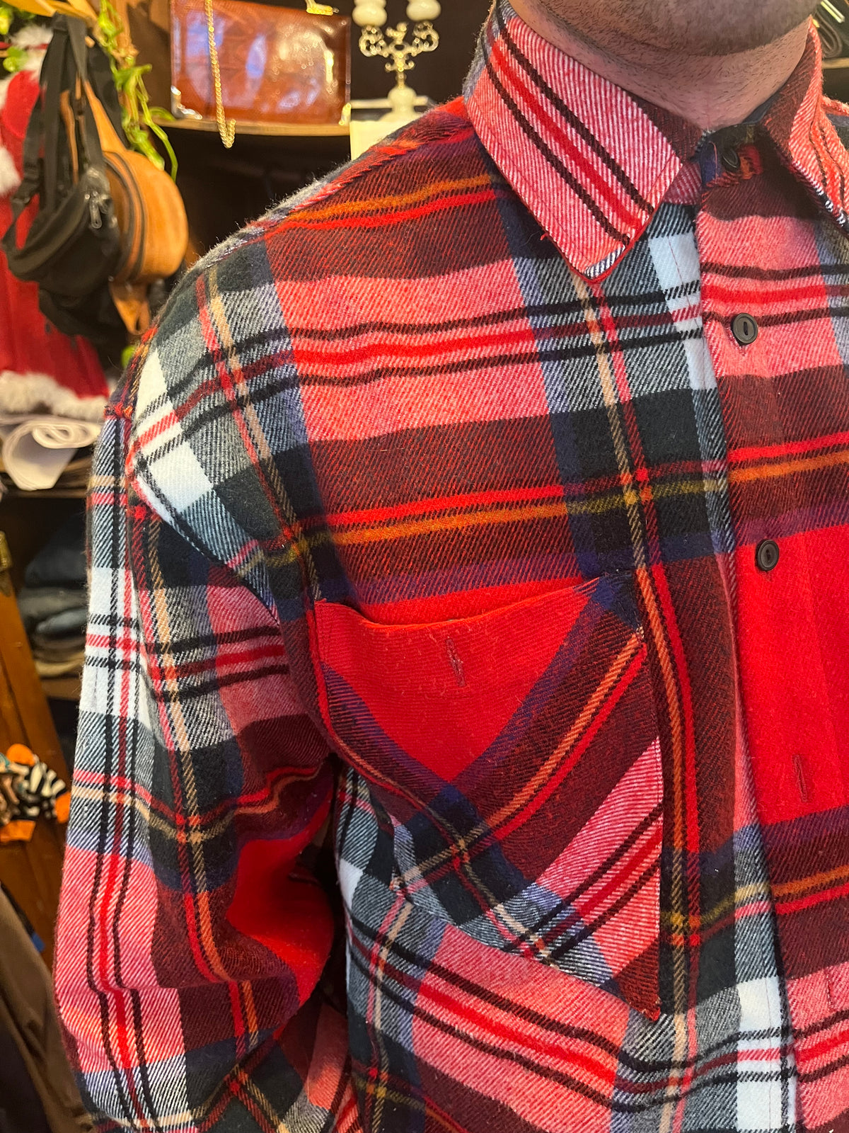 Vintage red tartan flannel shirt featuring a bold plaid pattern and double chest pockets. Relaxed oversized fit with a classic grunge-inspired 90s feel