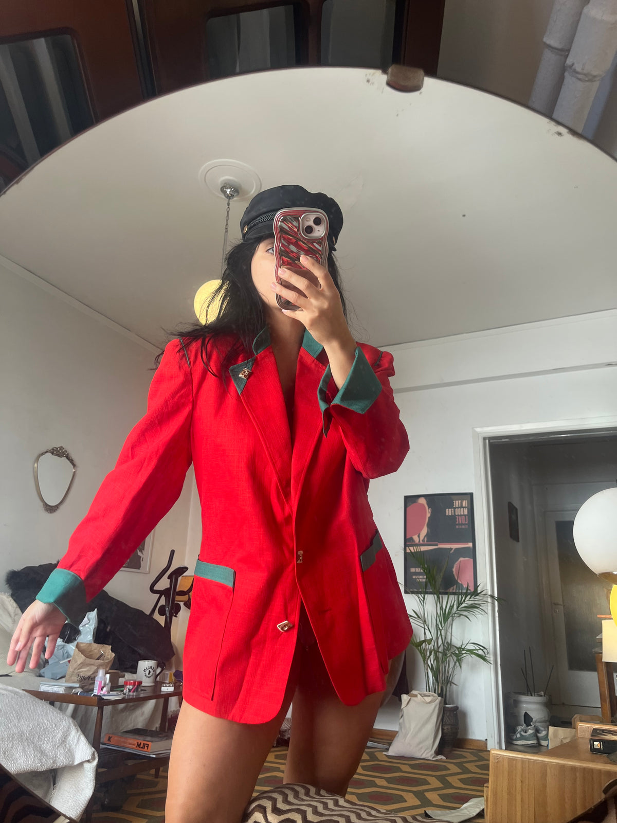 Vintage red blazer with contrasting green details and statement gold-tone buttons. Features structured shoulders and an oversized ’80s-inspired silhouette