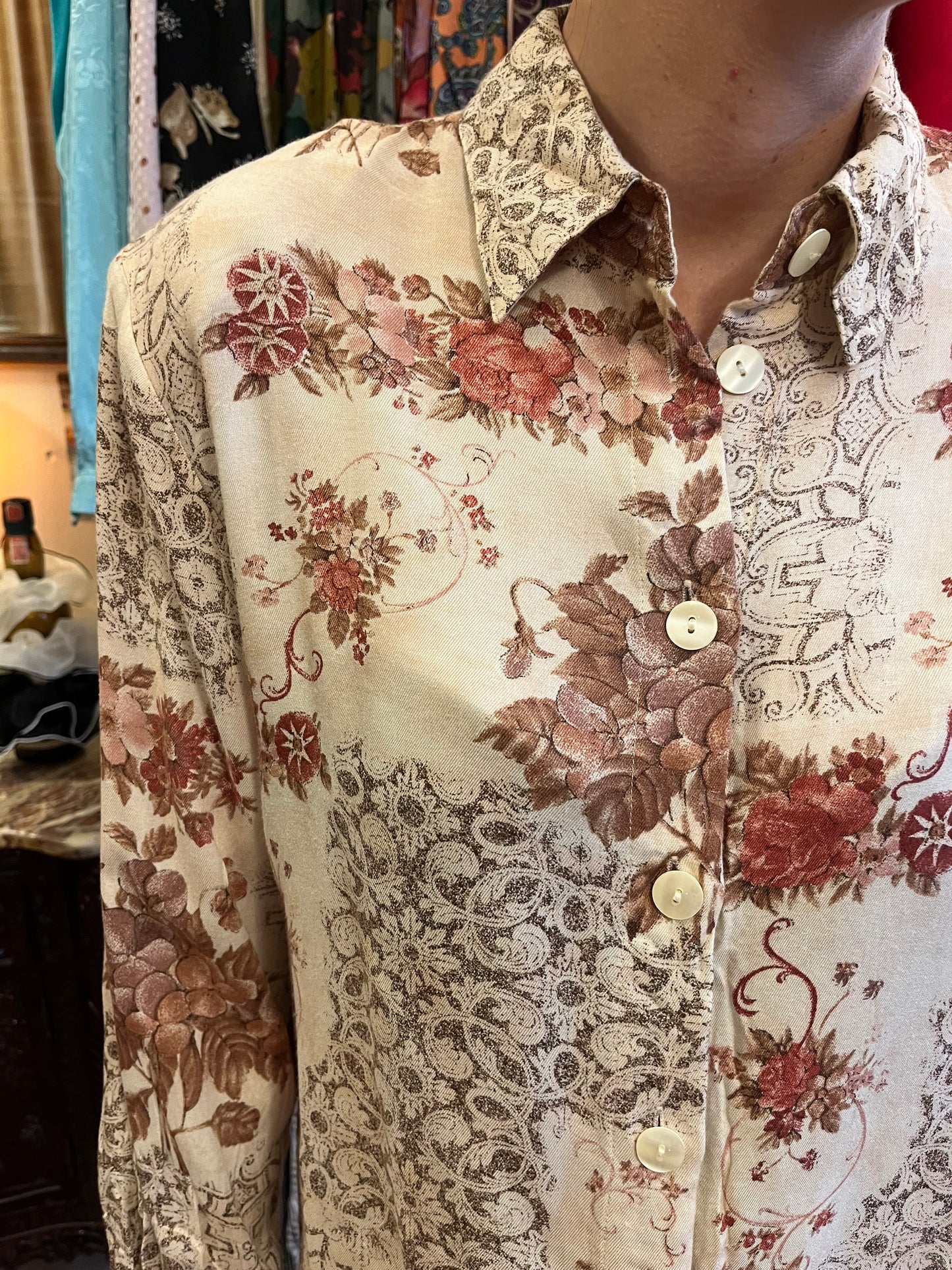 Floral button up shirt .Fits best S//M