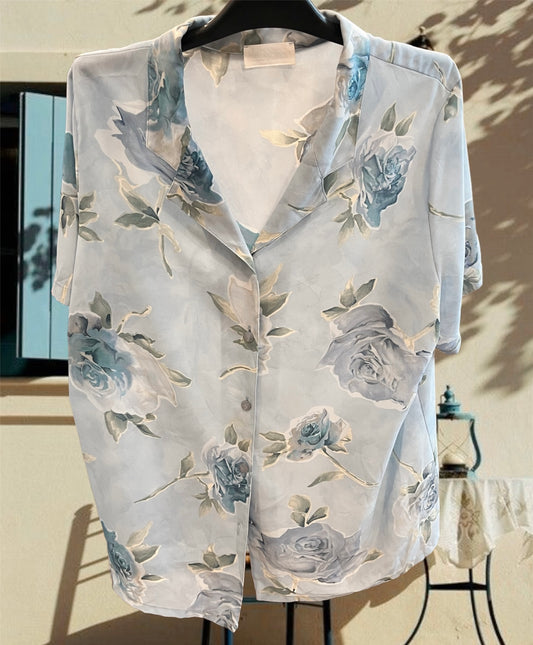 Vintage baby blue button up floral shirt .