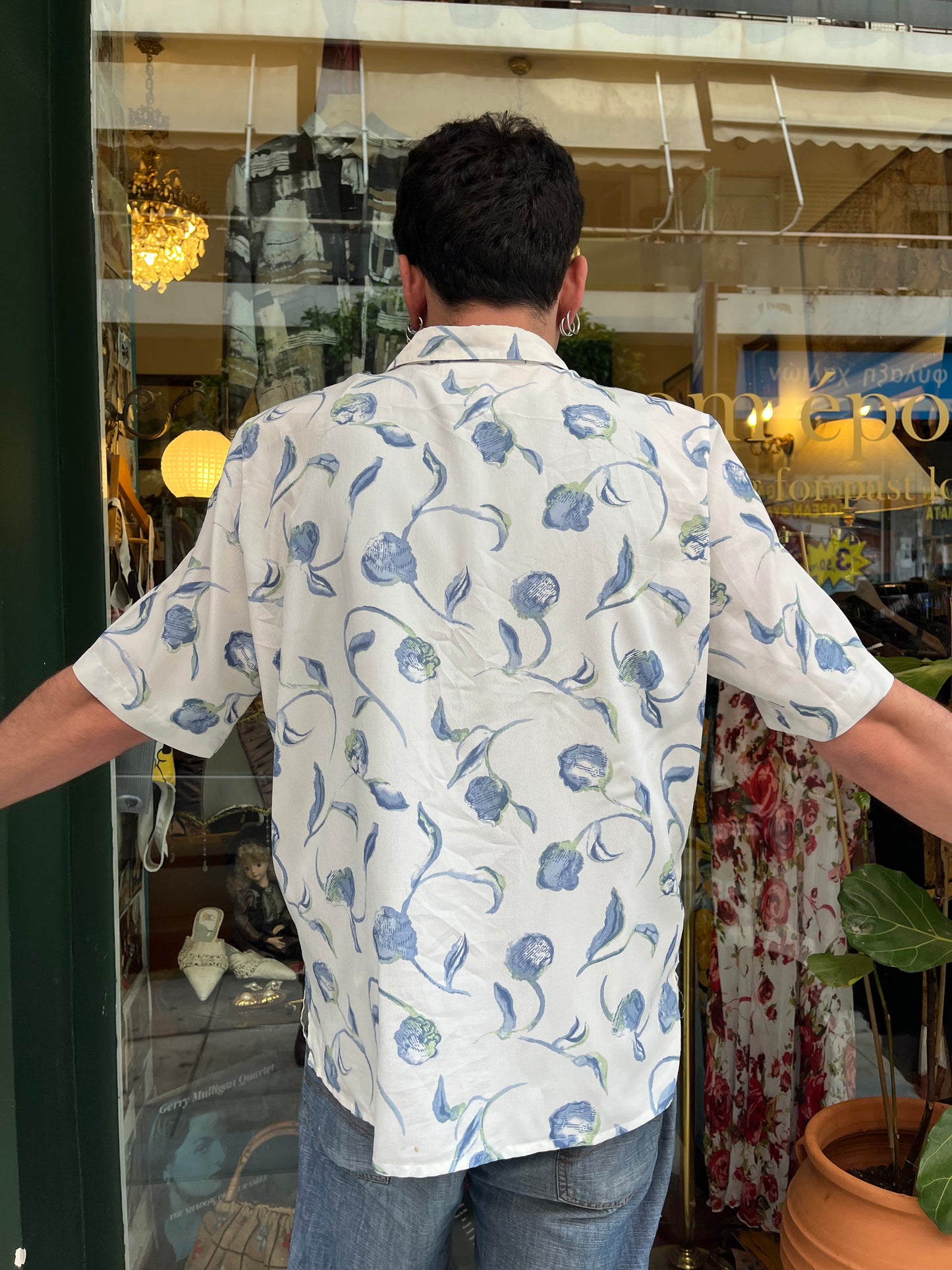 Floral button up shirt .Fits best M