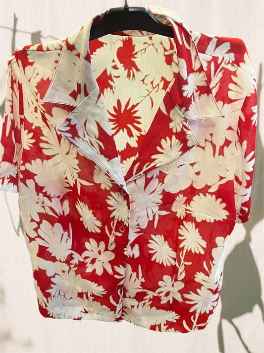 Floral button up shirt .Fits best M